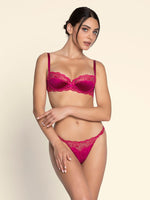 Model wearing 'Splendeur Soie' Raspberry Pink Silk Half Cup Bra, by Lise Charmel (front view).