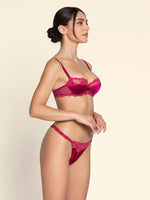 Model wearing 'Splendeur Soie' Raspberry Pink Silk Half Cup Bra, by Lise Charmel (side view).