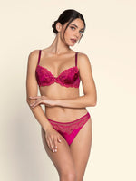 Model wearing 'Splendeur Soie' Raspberry Pink Silk Padded Plunge Bra, by Lise Charmel (front view).