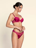 Model wearing 'Splendeur Soie' Raspberry Pink Silk Padded Plunge Bra, by Lise Charmel (side view).