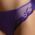 Model wearing 'Splendeur Soie' Violet Silk Fancy Brief, by Lise Charmel (detail).