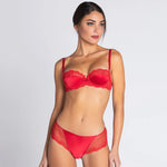 Model wearing 'Splendeur Soie' Shorty Brief in Rouge (red), by Lise Charmel.