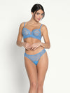 Model wearing 'Sublime en Dentelle' Azure Blue Thong, by Lise Charmel (front view).