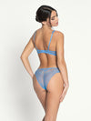 Model wearing 'Sublime en Dentelle' Azure Blue Italian Brief, by Lise Charmel (back view).