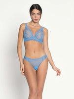Model wearing 'Sublime en Dentelle' Azure Blue Italian Brief, by Lise Charmel (front view).