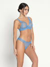 Model wearing 'Sublime en Dentelle' Azure Blue Italian Brief, by Lise Charmel (side view).