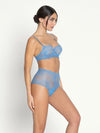 Model wearing 'Sublime en Dentelle' Azure Blue Half Cup Bra, by Lise Charmel (side view).