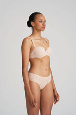 Model wearing 'Avero' Pearly Caffé Latte Padded Balcony Bra, by Marie Jo (side view).