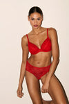 Model wearing 'Jane' Red Push-Up Plunge Bra with Removable Pads, by Marie Jo (front view).
