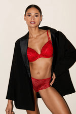 Model wearing 'Jane' Red Push-Up Plunge Bra with Removable Pads, by Marie Jo (front view).