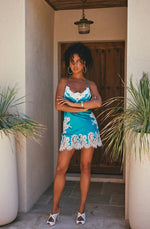 Model wearing 'Artemis' Turquoise and Ivory Short Silk Nightie, by Marjolaine (front view).