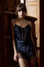 Model wearing 'Baccarat' Black Silk Camisole and Shorts Set, by Marjolaine (front view).