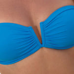 Model wearing 'Alba' Sky Blue Bandeau Bikini Top, by Melissa Odabash (detail).