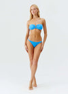 Model wearing 'Alba' Sky Blue Bandeau Bikini Set, by Melissa Odabash.