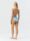 Model wearing 'Brussels' Pale Blue Halterneck Bikini Set, by Melissa Odabash (backview).