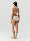 Model wearing 'Brussels' Lizard Halterneck Bikini Set, by Melissa Odabash (back view).