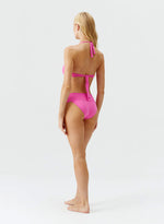 Model wearing 'Brussels' Watermelon Pink Halterneck Bikini Set, by Melissa Odabash (back view).
