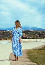 Model wearing 'Cecilia' Lotus Blue Maxi Beach Dress, by Melissa Odabash (front view).