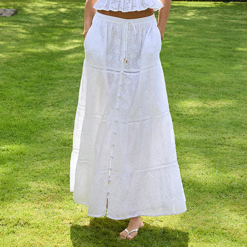Model wearing 'Cinzia' White Skirt, by Melissa Odabash (front view, close-up).