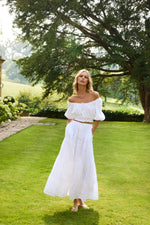 Model wearing 'Cinzia' White Skirt, by Melissa Odabash (front view).