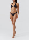 Model wearing 'Grenada' Black Halterneck Bikini Set, by Melissa Odabash (front view).