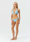 Model wearing 'Grenada' Pale Blue Halterneck Bikini Set, by Melissa Odabash (side view).