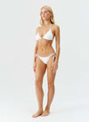 Model wearing 'Malibu' Ivory Bikini Set, by Melissa Odabash (side view).