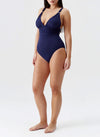 Model wearing 'Panarea' Navy Swimsuit, by Melissa Odabash (side view).