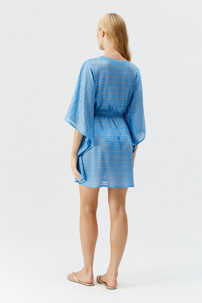 Model wearing Melissa Odabash 'Petra' Ocean Blue Short Kaftan (back view).