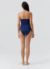 Model wearing 'Sydney' Marine Bandeau Swimsuit, by Melissa Odabash (back view).