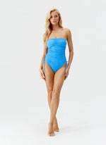 Model wearing 'Sydney' Sky Blue Bandeau Swimsuit, by Melissa Odabash (front view).