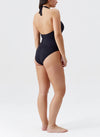 Model wearing 'Tampa' Black Halterneck Swimsuit, by Melissa Odabash (back view).