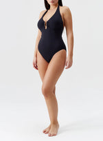 Model wearing 'Tampa' Black Halterneck Swimsuit, by Melissa Odabash.