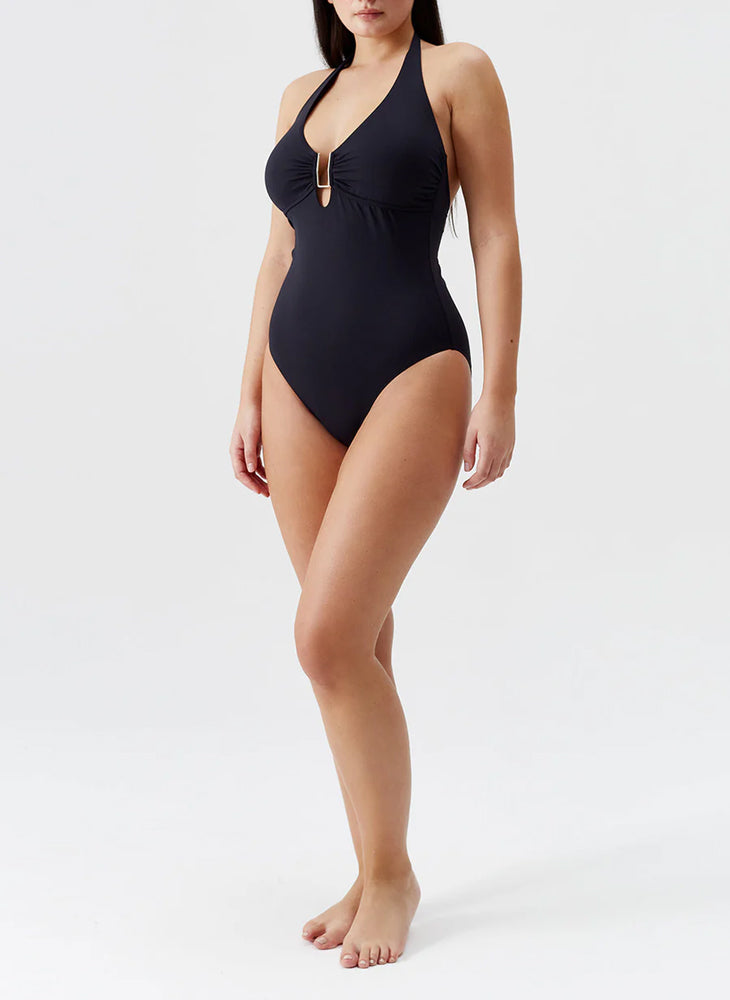 Model wearing 'Tampa' Black Halterneck Swimsuit, by Melissa Odabash.