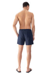 Model wearing 'Darley' Navy Blue Men's Swimming Shorts, by Mey (back view).