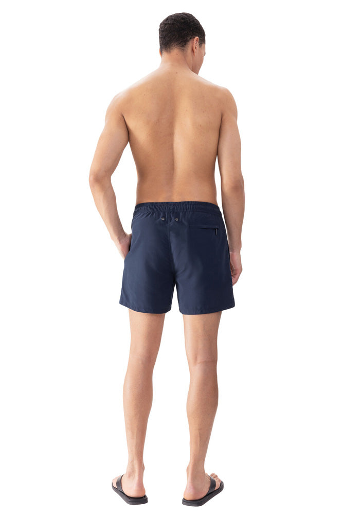 Model wearing 'Darley' Navy Blue Men's Swimming Shorts, by Mey (back view).