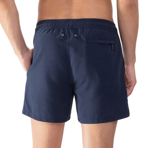 Model wearing 'Darley' Navy Blue Men's Swimming Shorts, by Mey (back view, close up).