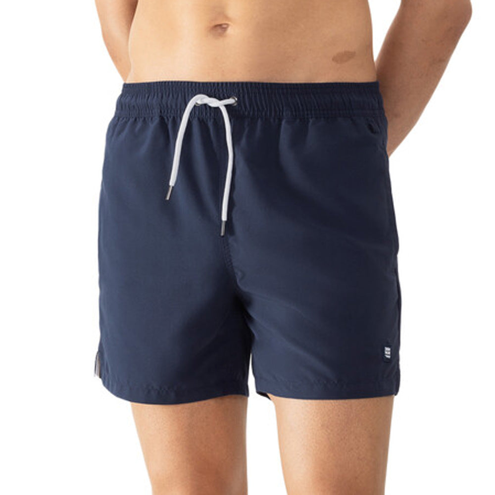 Model wearing 'Darley' Navy Blue Men's Swimming Shorts, by Mey (front view, close up).