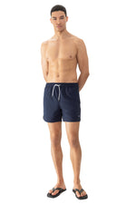 Model wearing 'Darley' Navy Blue Men's Swimming Shorts, by Mey (front view).