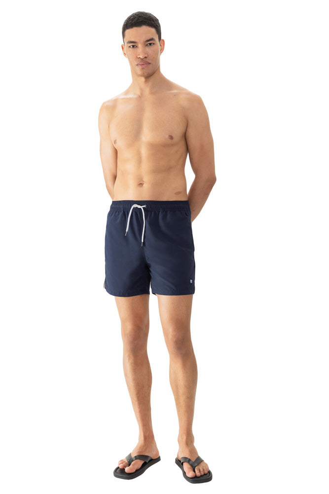 Model wearing 'Darley' Navy Blue Men's Swimming Shorts, by Mey (front view).