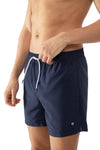 Model wearing 'Darley' Navy Blue Men's Swimming Shorts, by Mey (front view, close up).