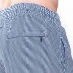 Model wearing 'Beachport' Blue Pinstripe Men's Swimming Shorts, by Mey (back view, close up).