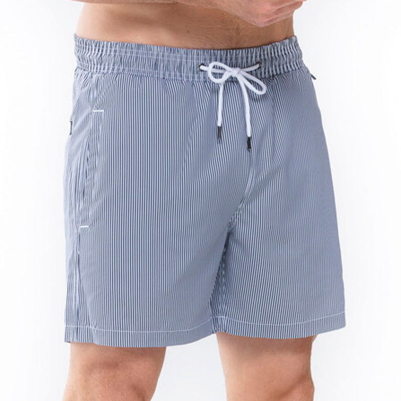 Model wearing 'Beachport' Blue Pinstripe Men's Swimming Shorts, by Mey (front view, close up).