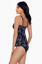 Model wearing 'Ayla' Tankini in Black/Multi from Miraclesuit's Bronze Reign collection.