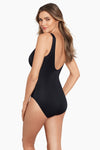 Model wearing 'Zipt' Plunge Zipup Swimsuit in Black from the Razzle Dazzle collection by Miraclesuit.