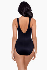 Model wearing 'Trinity' Shaping Swimsuit from the Spectra collection by Miraclesuit.
