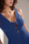 Model wearing 'Bonnie' Blue Plunge Swimsuit, by Pain de Sucre (front view).