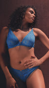 Model wearing 'Love Soul' Blue Plunge Triangle Bra, by Aubade.