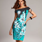 Model wearing 'Alma' Sea Green Tropical Print Resort Dress, by Roidal (front view).