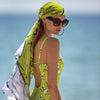 Model wearing Roidal Miranda collection 'Fara' Yellow Pareo as a headscarf.